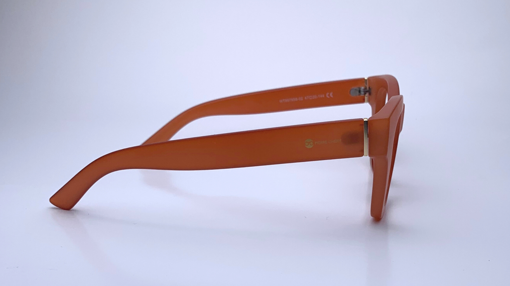 Ariel In Persimmon Crystal:   Modified Cat Eye Frame Fits Medium To Wide Faces